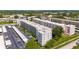 An aerial view of a condo complex with covered parking and meticulously maintained landscaping at 5603 80Th N St # 103, St Petersburg, FL 33709