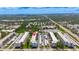 An aerial view of a condo complex with covered parking and meticulously maintained landscaping at 5603 80Th N St # 103, St Petersburg, FL 33709