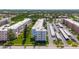 Beautiful aerial view of a condo complex with green landscaping, and lots of covered parking at 5603 80Th N St # 103, St Petersburg, FL 33709