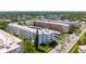 An aerial view of a condo complex with mature trees and meticulously maintained landscaping at 5603 80Th N St # 103, St Petersburg, FL 33709