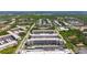 Condo complex aerial view showing multiple buildings, parking, and lush trees in a neighborhood setting at 5603 80Th N St # 103, St Petersburg, FL 33709