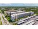 Beautiful aerial view of a condo complex with green landscaping, and lots of covered parking at 5603 80Th N St # 103, St Petersburg, FL 33709