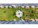 Top-down aerial view showing buildings surrounding a green courtyard with sitting areas at 5603 80Th N St # 103, St Petersburg, FL 33709