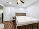 Bedroom with wood-look floors, ceiling fan, and neutral walls for a calming, inviting space at 5603 80Th N St # 103, St Petersburg, FL 33709