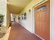A condo entrance features a brown front door and the unit number 103 at 5603 80Th N St # 103, St Petersburg, FL 33709