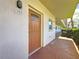 Unit 103 entrance featuring decorative glass on solid front door at 5603 80Th N St # 103, St Petersburg, FL 33709
