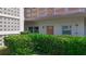 Condo entrance with unit number 103 surrounded by green landscaping at 5603 80Th N St # 103, St Petersburg, FL 33709