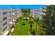 Beautiful lawn and garden area between two buildings of a multi-unit condo complex at 5603 80Th N St # 103, St Petersburg, FL 33709