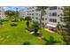Exterior daytime aerial view showcasing the condo buildings and landscaped lawns at 5603 80Th N St # 103, St Petersburg, FL 33709