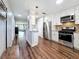 Updated kitchen featuring stainless steel appliances and open view to living room at 5603 80Th N St # 103, St Petersburg, FL 33709