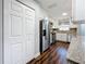 Open kitchen with stainless steel appliances and wooden floor at 5603 80Th N St # 103, St Petersburg, FL 33709