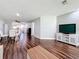 Open living and dining area with modern furnishings and wood floors at 5603 80Th N St # 103, St Petersburg, FL 33709