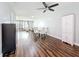 Living room and dining room area with modern furnishings and wood floors at 5603 80Th N St # 103, St Petersburg, FL 33709