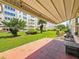 Private patio with awning overlooking the landscaped green space at 5603 80Th N St # 103, St Petersburg, FL 33709