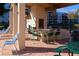 Outdoor grill and dining area by the community pool at 5603 80Th N St # 103, St Petersburg, FL 33709