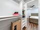 Walk-in closet with shelving for organization, providing ample storage space at 5603 80Th N St # 103, St Petersburg, FL 33709