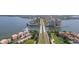 Stunning aerial view showcasing the waterfront condos, a canal and lush landscaping at 5633 Puerta Del Sol S Blvd # 204, St Petersburg, FL 33715