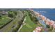Panoramic aerial of condo community, golf course, and waterfront views at 5633 Puerta Del Sol S Blvd # 204, St Petersburg, FL 33715