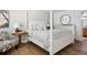 This bright bedroom features a four-poster bed, wood floors, and a beach-themed decor at 5633 Puerta Del Sol S Blvd # 204, St Petersburg, FL 33715