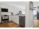 Bright kitchen features modern stainless steel appliances and leads to the dining area at 5633 Puerta Del Sol S Blvd # 204, St Petersburg, FL 33715