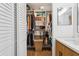 Spacious walk-in closet with ample storage and custom shelving solutions and natural light at 5633 Puerta Del Sol S Blvd # 204, St Petersburg, FL 33715