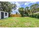 A spacious yard with mature landscaping providing natural shade and privacy at 5847 Harrison St, New Port Richey, FL 34653