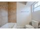 Bathroom with a soaking tub, tiled shower, and modern fixtures at 5847 Harrison St, New Port Richey, FL 34653
