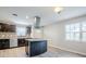 Modern kitchen with stainless steel appliances, granite countertops, and ample cabinet space at 5847 Harrison St, New Port Richey, FL 34653