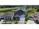 A stunning aerial view highlights the home's premium lot with serene water views and manicured landscaping at 5971 Hidden Branch Dr, Apollo Beach, FL 33572