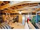 Spacious unfinished attic featuring exposed wood beams and ample storage, ready for customization and added value at 5971 Hidden Branch Dr, Apollo Beach, FL 33572