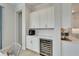 Coffee and wine bar with custom cabinets and countertops at 5971 Hidden Branch Dr, Apollo Beach, FL 33572
