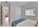 Bright bedroom featuring a window, closet and access to other rooms at 5971 Hidden Branch Dr, Apollo Beach, FL 33572