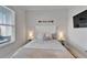 Cozy bedroom featuring a bed with decorative pillows and bedside tables with lamps providing a warm ambiance at 5971 Hidden Branch Dr, Apollo Beach, FL 33572