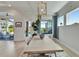 Bright dining room with views of the outdoor living area and pool at 5971 Hidden Branch Dr, Apollo Beach, FL 33572