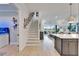 Welcoming entryway featuring an elegant staircase and a view into the living area at 5971 Hidden Branch Dr, Apollo Beach, FL 33572
