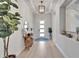 Inviting entryway with modern decor, stylish lighting, and a decorative table, creating a welcoming first impression at 5971 Hidden Branch Dr, Apollo Beach, FL 33572