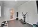 Well-equipped exercise room with workout equipment and access to bathroom at 5971 Hidden Branch Dr, Apollo Beach, FL 33572