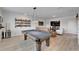 Spacious game room with pool table, stylish bar and comfortable seating at 5971 Hidden Branch Dr, Apollo Beach, FL 33572