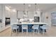 Bright kitchen with a large island, pendant lighting, and stainless steel appliances at 5971 Hidden Branch Dr, Apollo Beach, FL 33572