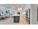 Modern kitchen with stainless steel appliances and view to the living room at 5971 Hidden Branch Dr, Apollo Beach, FL 33572