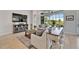 Bright living room with comfortable seating and a view of the outdoor space at 5971 Hidden Branch Dr, Apollo Beach, FL 33572
