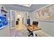 Modern office featuring an aquarium and open view to the kitchen at 5971 Hidden Branch Dr, Apollo Beach, FL 33572