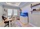Bright office space with a built-in aquarium and custom shelving at 5971 Hidden Branch Dr, Apollo Beach, FL 33572