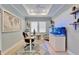 Comfortable home office with a tray ceiling, aquarium, and natural light at 5971 Hidden Branch Dr, Apollo Beach, FL 33572