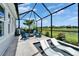 Inviting pool area with Adirondack chairs and comfortable loungers, creating a perfect outdoor oasis at 5971 Hidden Branch Dr, Apollo Beach, FL 33572