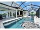 Beautiful pool featuring a screened-in lanai, ideal for outdoor entertaining and enjoying the scenic views at 5971 Hidden Branch Dr, Apollo Beach, FL 33572