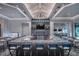 Chic clubhouse bar featuring a spacious marble countertop, modern seating, and stylish lighting fixtures at 6162 Winding Pine Dr, Nokomis, FL 34275