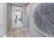 Hallway decorated with a large art piece that leads to other rooms at 6162 Winding Pine Dr, Nokomis, FL 34275