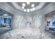 Elegant lobby adorned with marble accents, sophisticated lighting, and comfortable seating areas at 6162 Winding Pine Dr, Nokomis, FL 34275