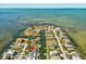 Breathtaking aerial view of waterfront homes with serene canal access and open bay views at 6531 Seaview Blvd, Hudson, FL 34667